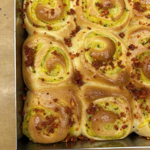 Fresh baked garlic pesto bread rolls from Crème It Up bakery Chandigarh